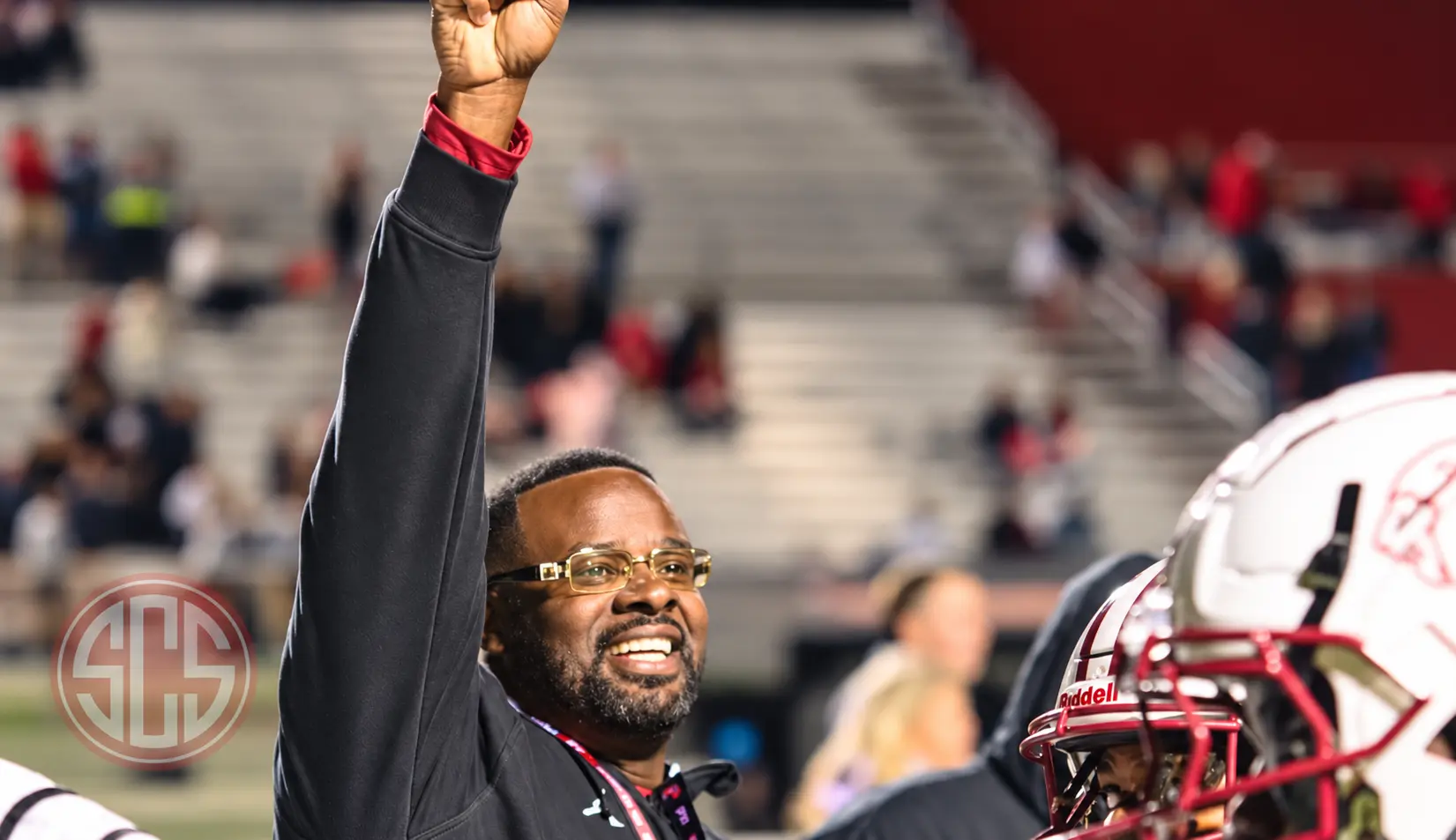 Coach Tavarus R. Finley celebrating on the sideline